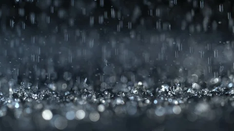 Heavy rain on dark background, shooted with high speed cinema camera at 1000 fps Stock Footage 94762587