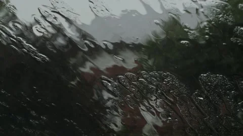 Heavy rain dripping on the windshield of the car Stock Footage 201594667