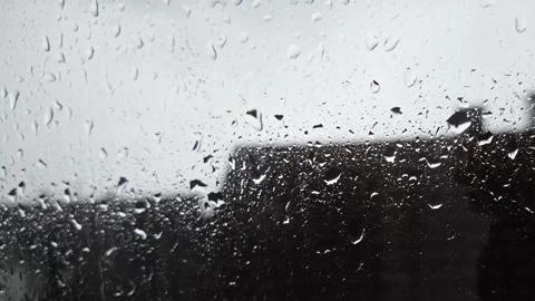 Heavy Rain Droplets Streaming Down Window Glass Stock Footage 345654850