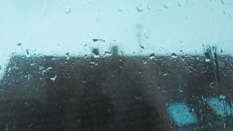 Heavy Rain Droplets Streaming Down Window Glass Stock Footage 346043194