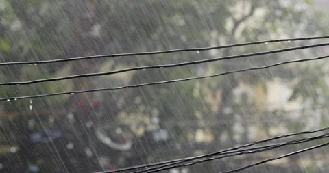 Heavy rain drops on of city during rainy season. Stockbeeldmateriaal 162539788