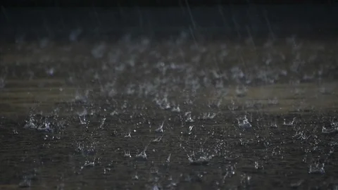Heavy rain drops falling on black background Stock Footage 119878730
