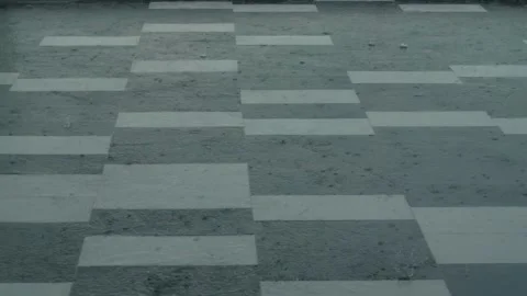 Heavy rain drops falling on city asphalt floor tiles during a heavy thunder.. Stock Footage 229842310