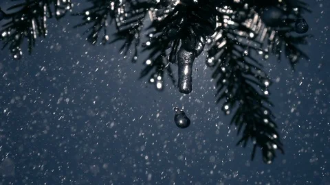 Heavy rain drops falling from fir needles and frozen icicles in slow-mo Stock Footage 90656780
