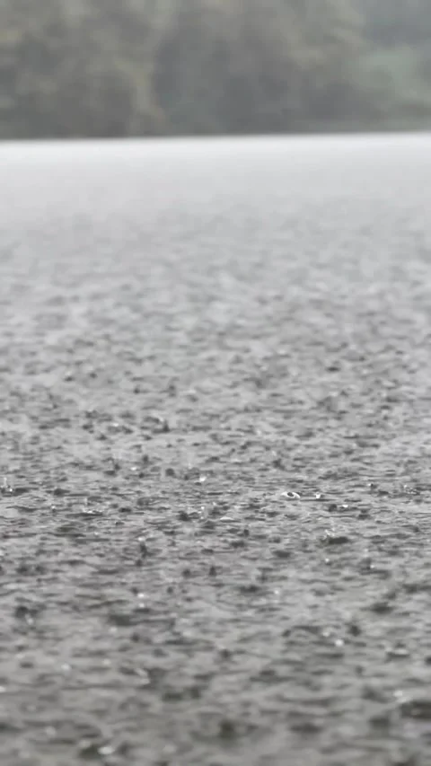 Heavy Rain Drops Hitting Water Surface Close Up Stock Footage 330753084