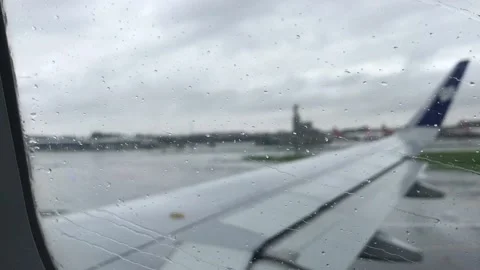 Heavy rain fall at the time of flight Takeoff shoot from window Stock Footage 157284511