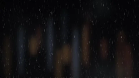 Heavy Rain Falling Against Blurred City Lights at Night 動画素材 347964188