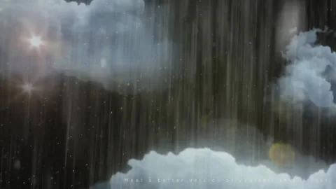 Heavy rain falling against dark storm clouds with bright sun flare cinematic Stock Footage 340942918