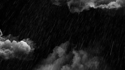 Heavy rain falling against a dark cloudy night sky with dramatic atmosphere and Stock Footage 345634737