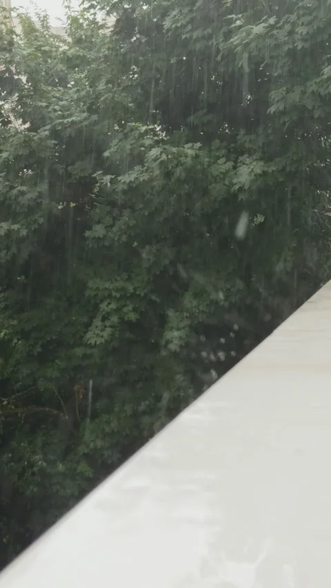 Heavy rain falling on balcony railing Stock Footage 341772295