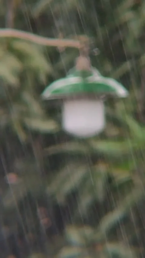 Heavy Rain Falling on Blurry Outdoor Street Lamp Stock Footage 345573184