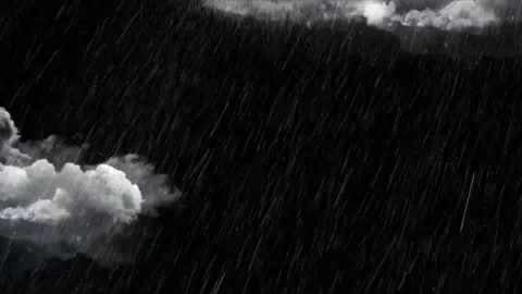 Heavy rain falling from dark storm clouds in a dramatic night sky with high Stock Footage 345634773