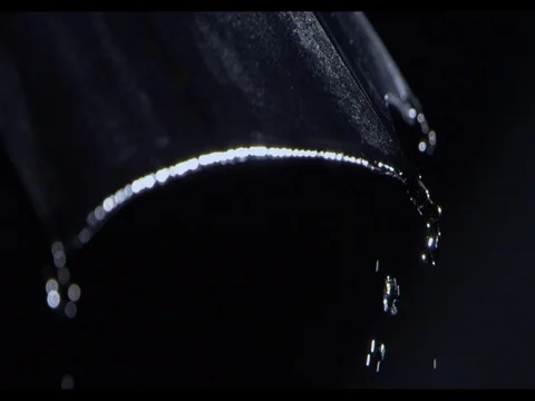 Heavy rain falling on an edge of black umbrella, slow motion Stock Footage 74223804