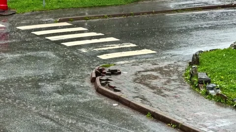 Heavy rain falling on empty crosswalk street in Flam Norway Stock Footage 341536235