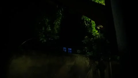 Heavy Rain Falling at Night Seen Through a Dark Balcony Frame Vídeos de archivo 321398149