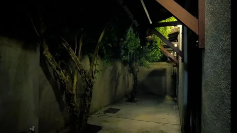 Heavy Rain Falling at Night Seen Through a Dark Balcony Frame Stockbeeldmateriaal 321398150