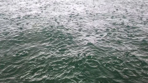Heavy Rain Falling on Ocean Surface During Storm Stockbeeldmateriaal 331154126
