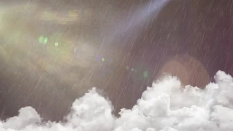 Heavy rain falling over white cumulus clouds with bright sunlight lens flare in Stock Footage 345853680