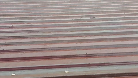 Heavy Rain Falling on Rusty Corrugated Metal Roof During Storm Stock Footage 346304361