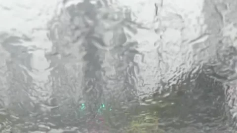 Heavy rain falling through the car window Video stock 246195140