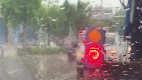 Heavy rain falling through the car window Stock Footage 246195411