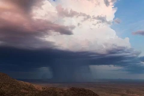 Heavy rain falling from a thunderstorm Stock Photos