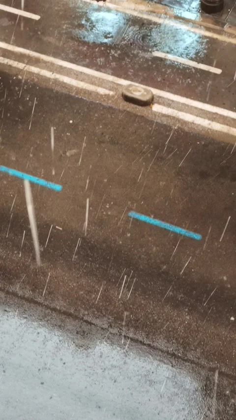 Heavy rain falling on wet asphalt road during summer storm Stock Footage 346767389