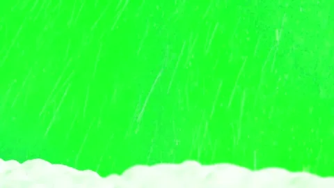 Heavy rain falling on a white snowy surface against a green screen background Stock Footage 345853225