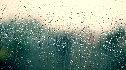 Heavy rain falling on window surface Video stock 100428122