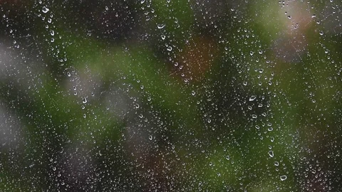 Heavy rain falling on window surface Stock Footage 133002331