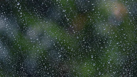 Heavy rain falling on window surface Stock Footage 149394966