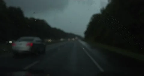Heavy rain falling on a windshield Stock Footage 229717538