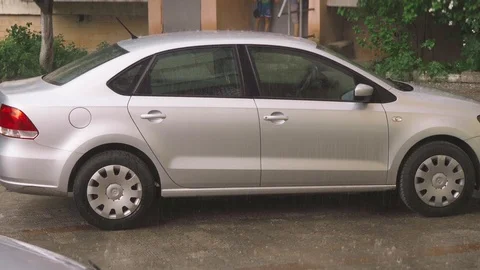 Heavy rain falls on the car Stock Footage 109392965