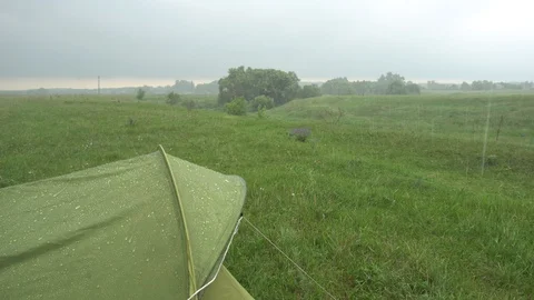 Heavy rain falls on the tent. Stock Footage 112974937