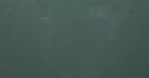 Heavy rain falls onto window during storm, on site sound Stock Footage 111421558