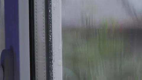 Heavy rain flows down the window. Raindrops falling in slow motion. Rain in slow Video stock 261221108