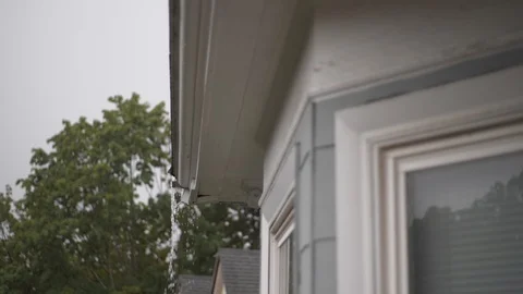 Heavy rain from gutter - Slow Motion HD - Dolly Stock Footage 120266902