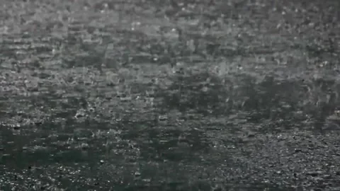 Heavy rain hits asphalts surface Stock Footage 297729652