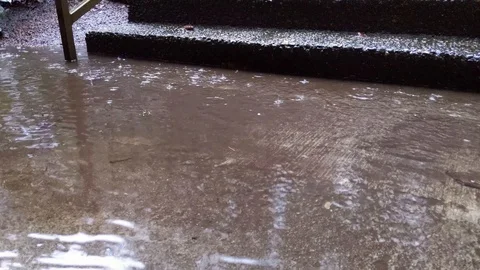 Heavy rain hitting a paved set of stairs. Stock Footage 121724550