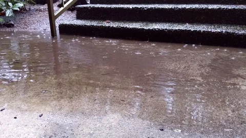 Heavy rain hitting a paved set of stairs. Stock Footage 121724656