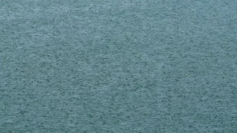 Heavy rain hitting the surface of the sea Stock Footage 295806764