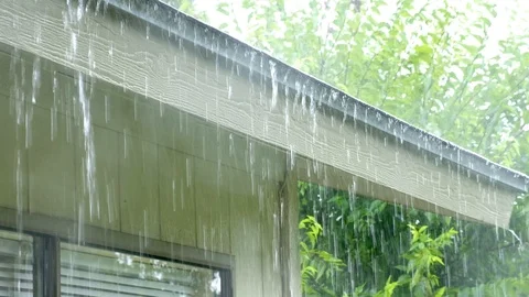 Heavy rain on house roof Stock Footage