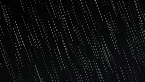 Heavy rain looping background with white droplets falling diagonally on a dar Stock Footage 346707737