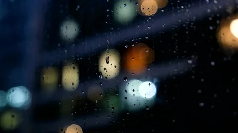 Heavy rain at night, raindrops falling on window Stock Footage 194325384