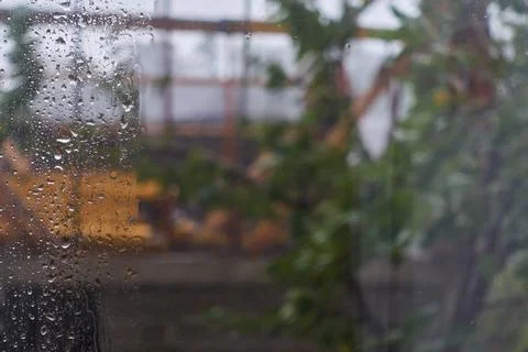 Heavy rain outside the window, drops on the glass, Stock Photos