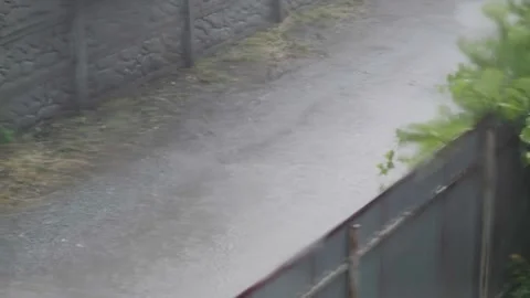 Heavy rain outside the window. Rain in the city. Hurricane outside the window of Stock Footage 264540891
