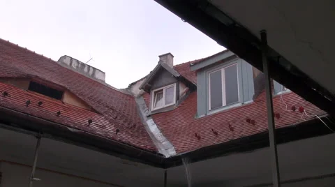 Heavy rain over rooftop, windows, drainpipe, tiles, bad weather Stock Footage 47485011