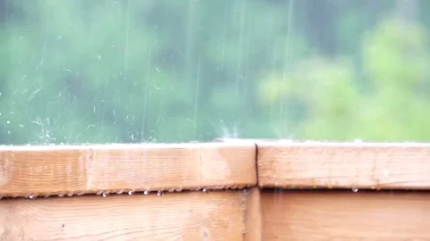 Heavy rain on a porch railing Stock Footage 81001526