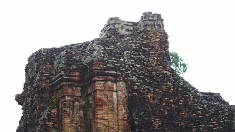 Heavy rain pouring down on an ancient brick temple ruin. 動画素材 336983010