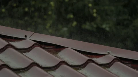 Heavy Rain Pouring Down on Red Metallic Roof of House. Gutter During Rainy .. Stock Footage 327609882
